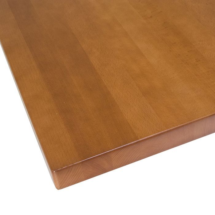 A close up of a wooden table top on a white background