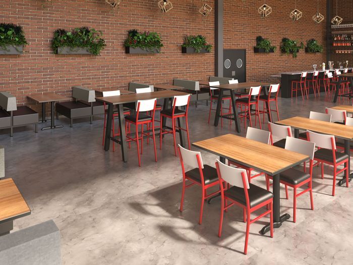 A restaurant with tables and chairs and a brick wall.