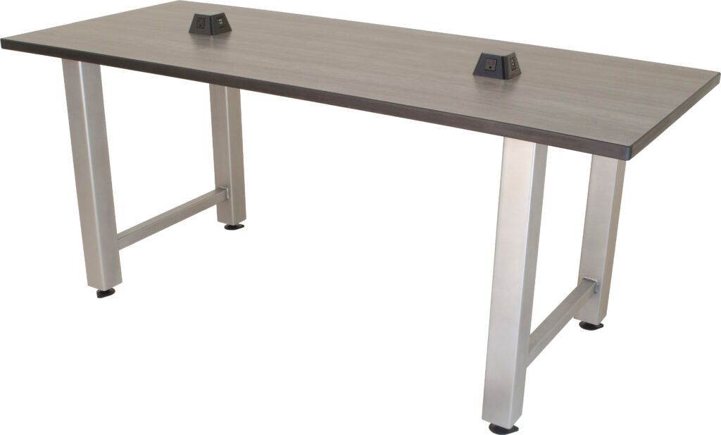 A stainless steel table with a wooden top and metal legs