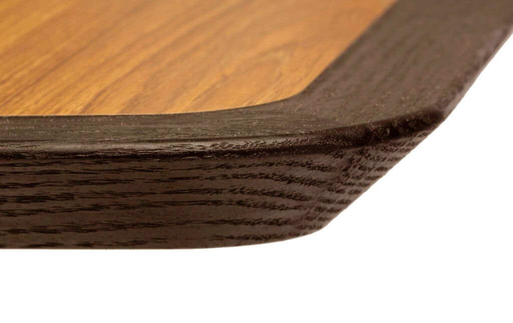 A close up of a wooden table with a white background