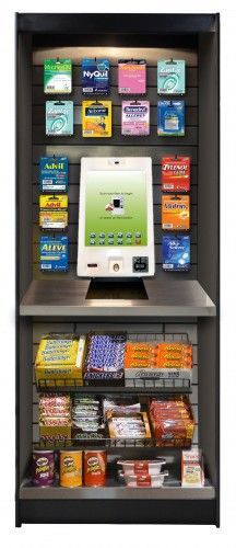 A store display with a computer on top of it.