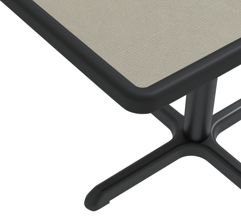 A table with a black frame and a beige top
