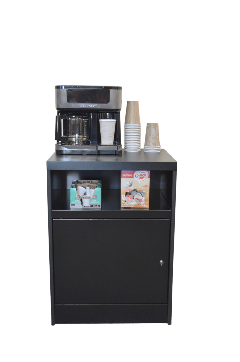 A coffee maker is sitting on top of a black cabinet.