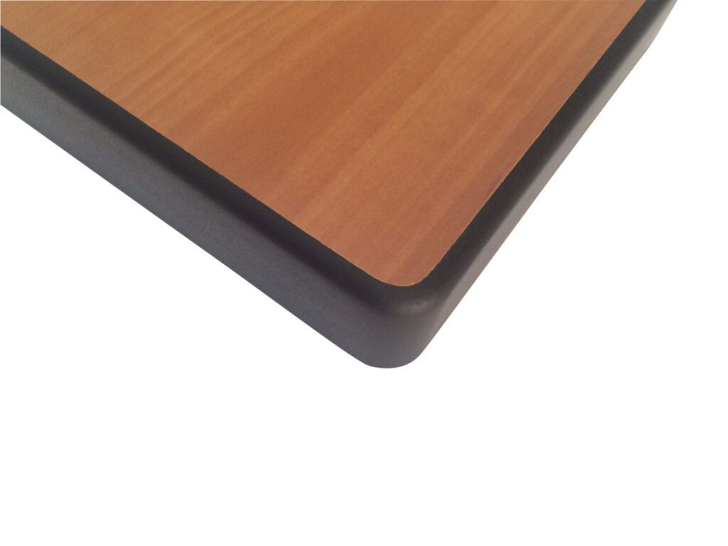 A close up of a wooden table with a black border