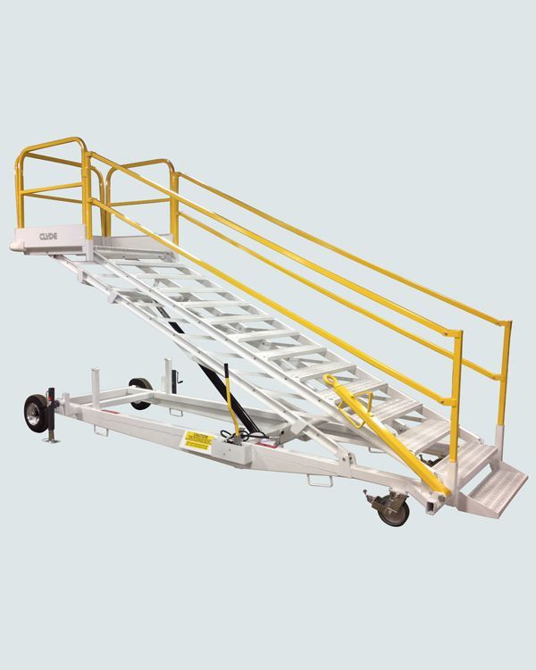 A ladder with a yellow railing on a trailer