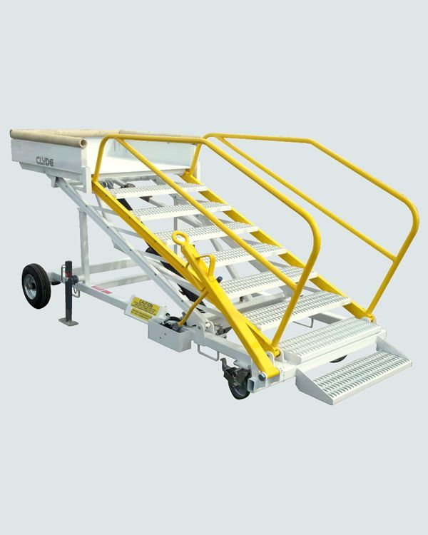 A set of stairs with wheels and a yellow railing