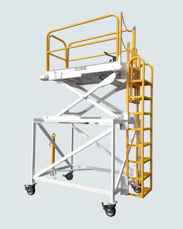 A white and yellow scaffolding with a ladder attached to it.
