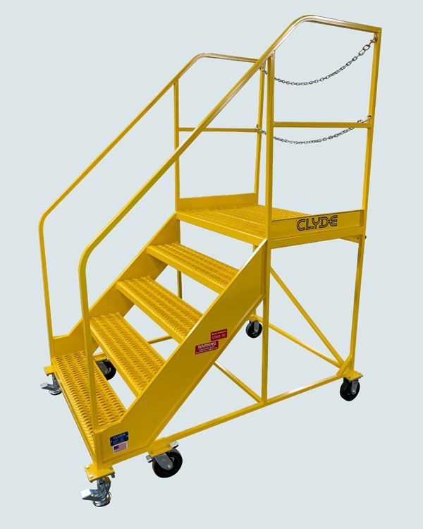 A yellow metal staircase with wheels and a railing