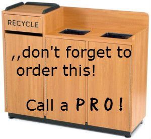 A wooden recycling bin that says 