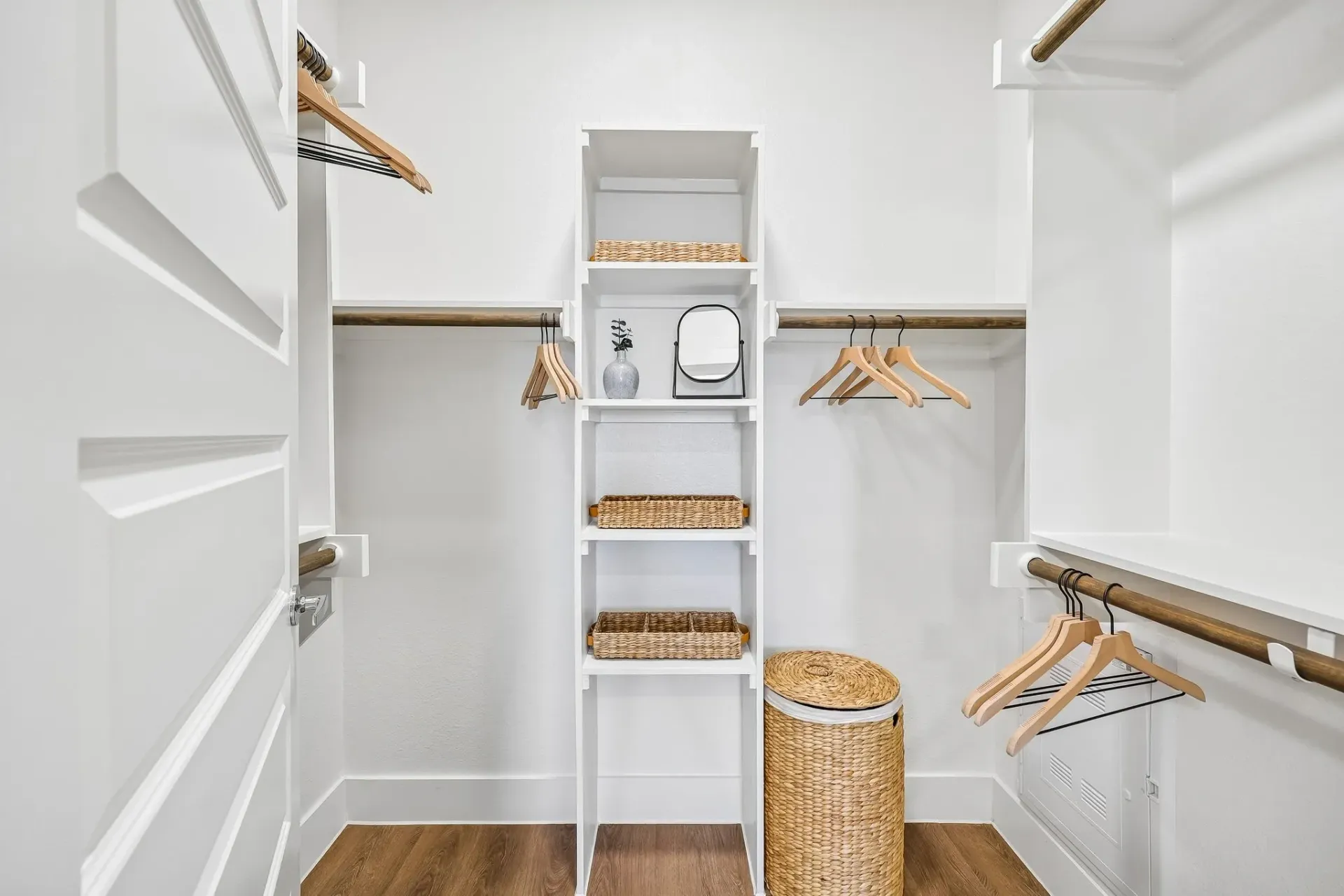 Spacious walk-in closet with built-in shelving and ample hanging space at The Grayson.