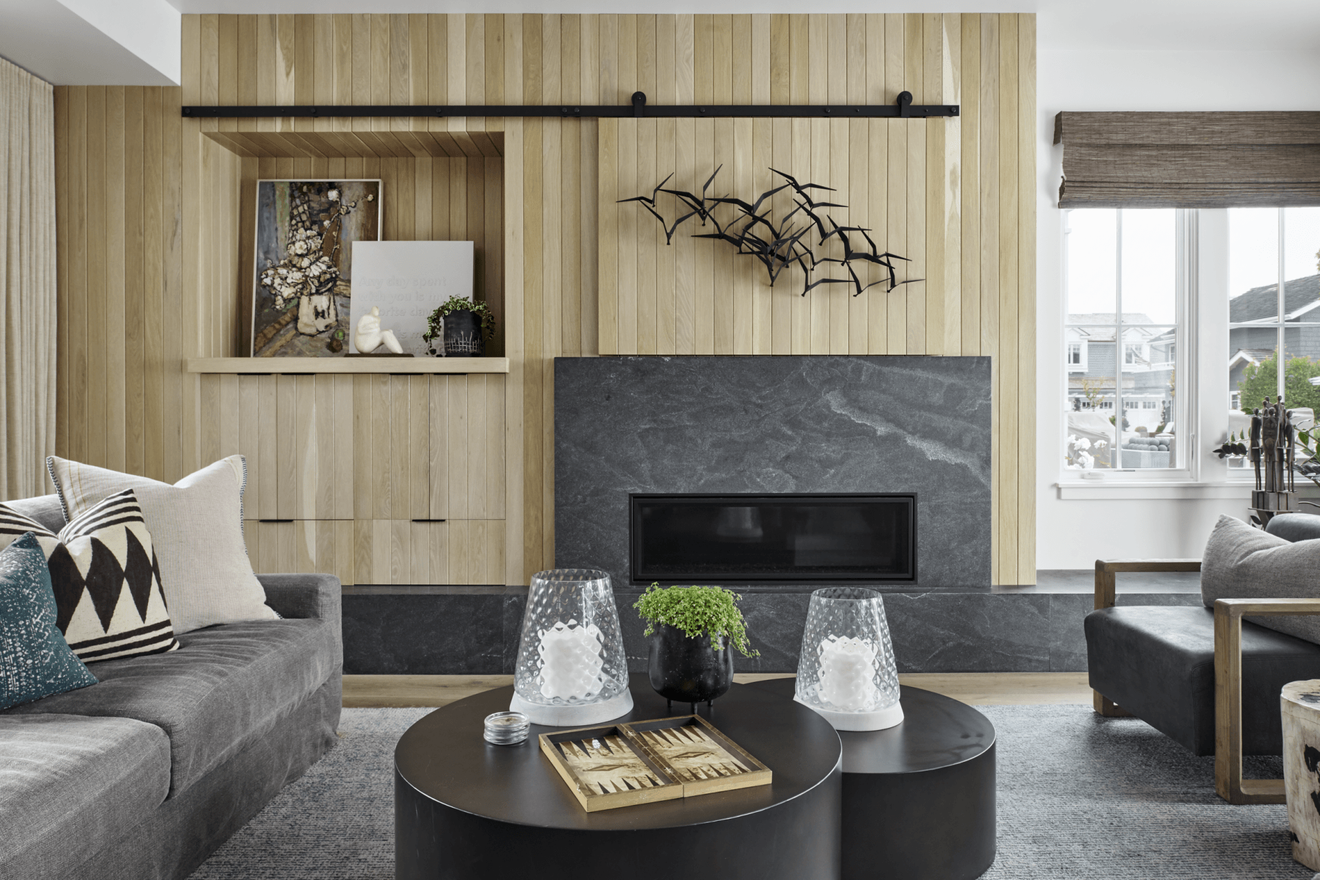 There is a fireplace in the middle of the living room.