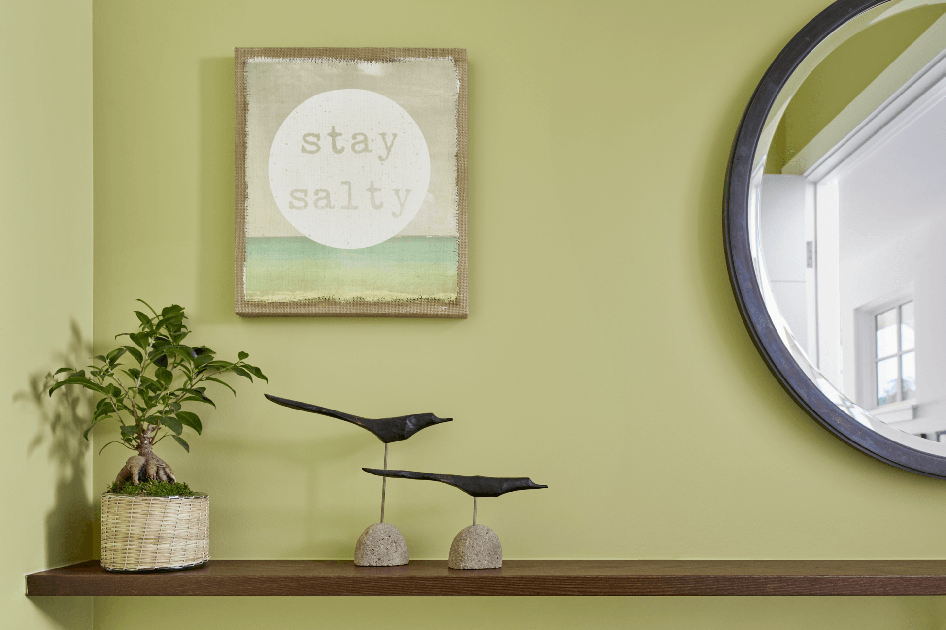 A picture on a wall that says stay salty