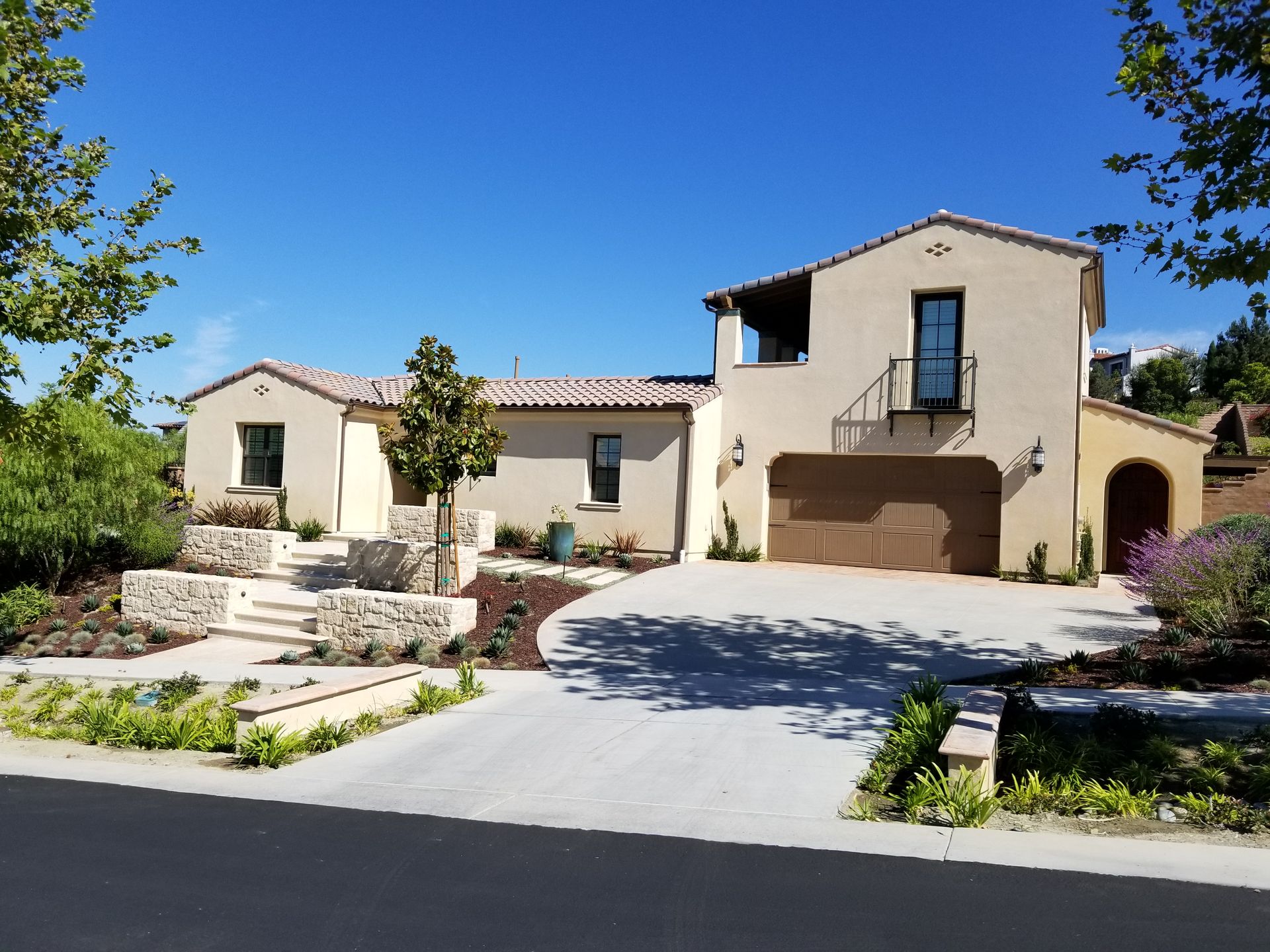 A large house with a driveway leading to it