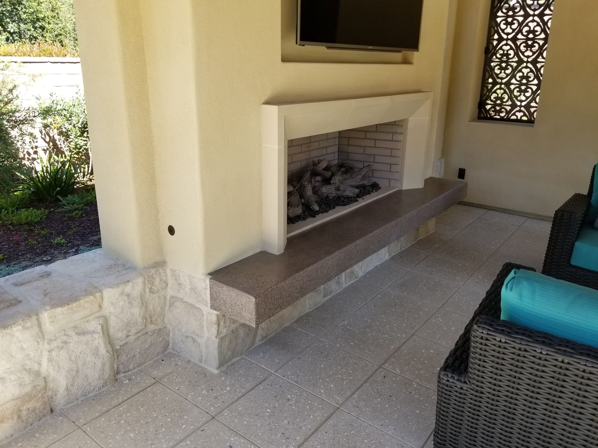 A fireplace with a television above it in a living room.