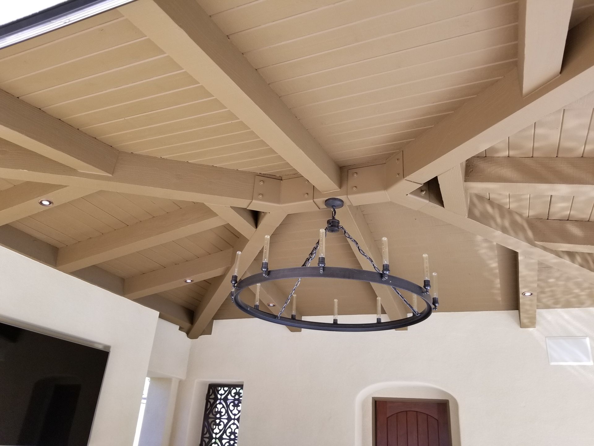 A chandelier is hanging from the ceiling of a room