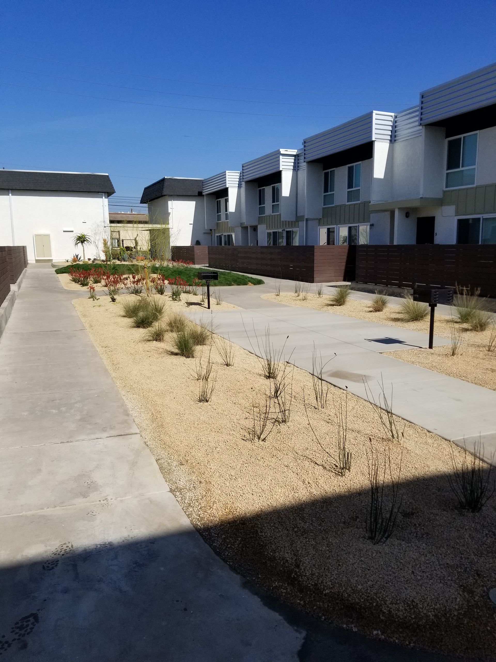 A row of buildings with a walkway between them