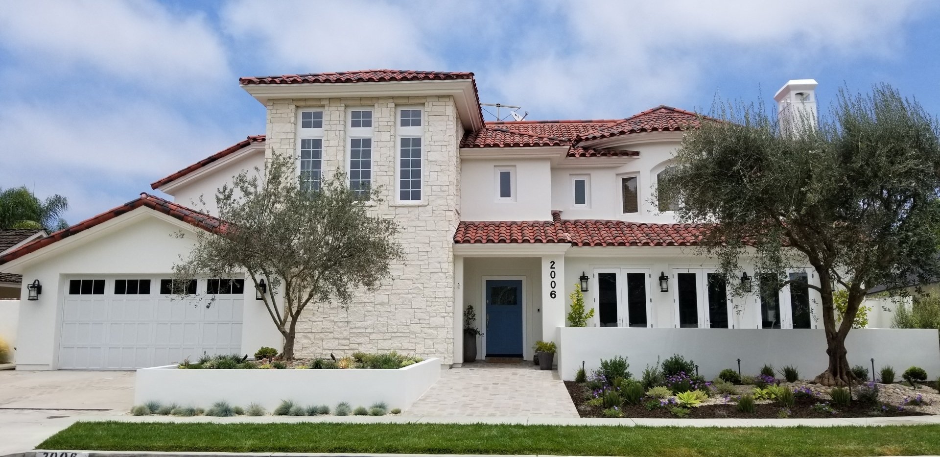 A large white house with a blue door