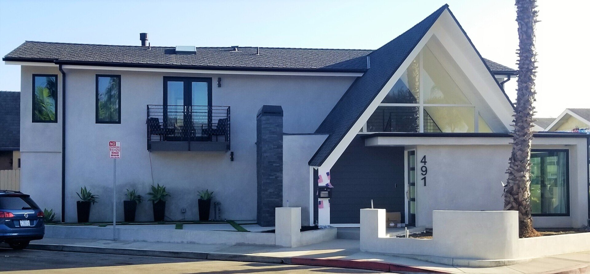 A house with a no parking sign in front of it