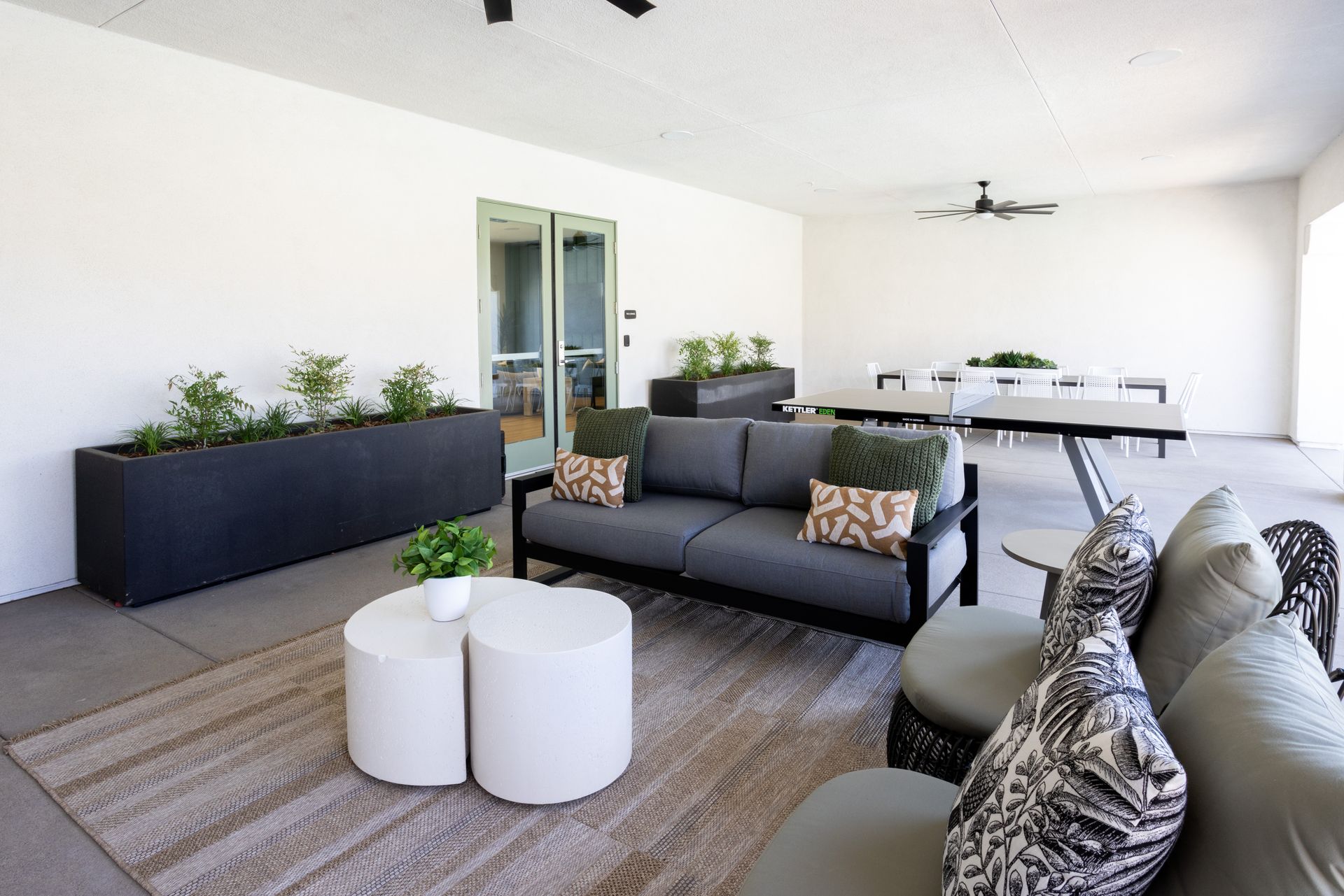 A living room with a couch and two tables