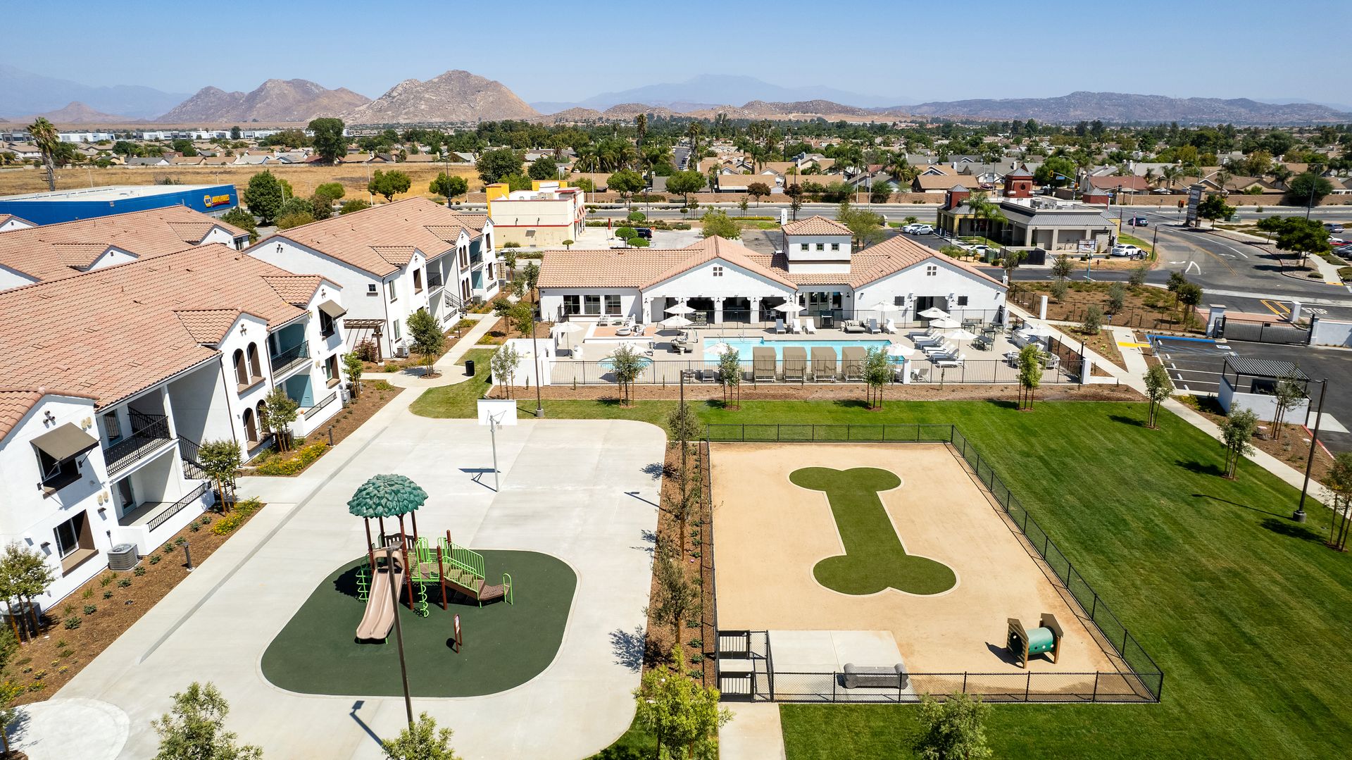 An aerial view of a playground with the letter i in the middle