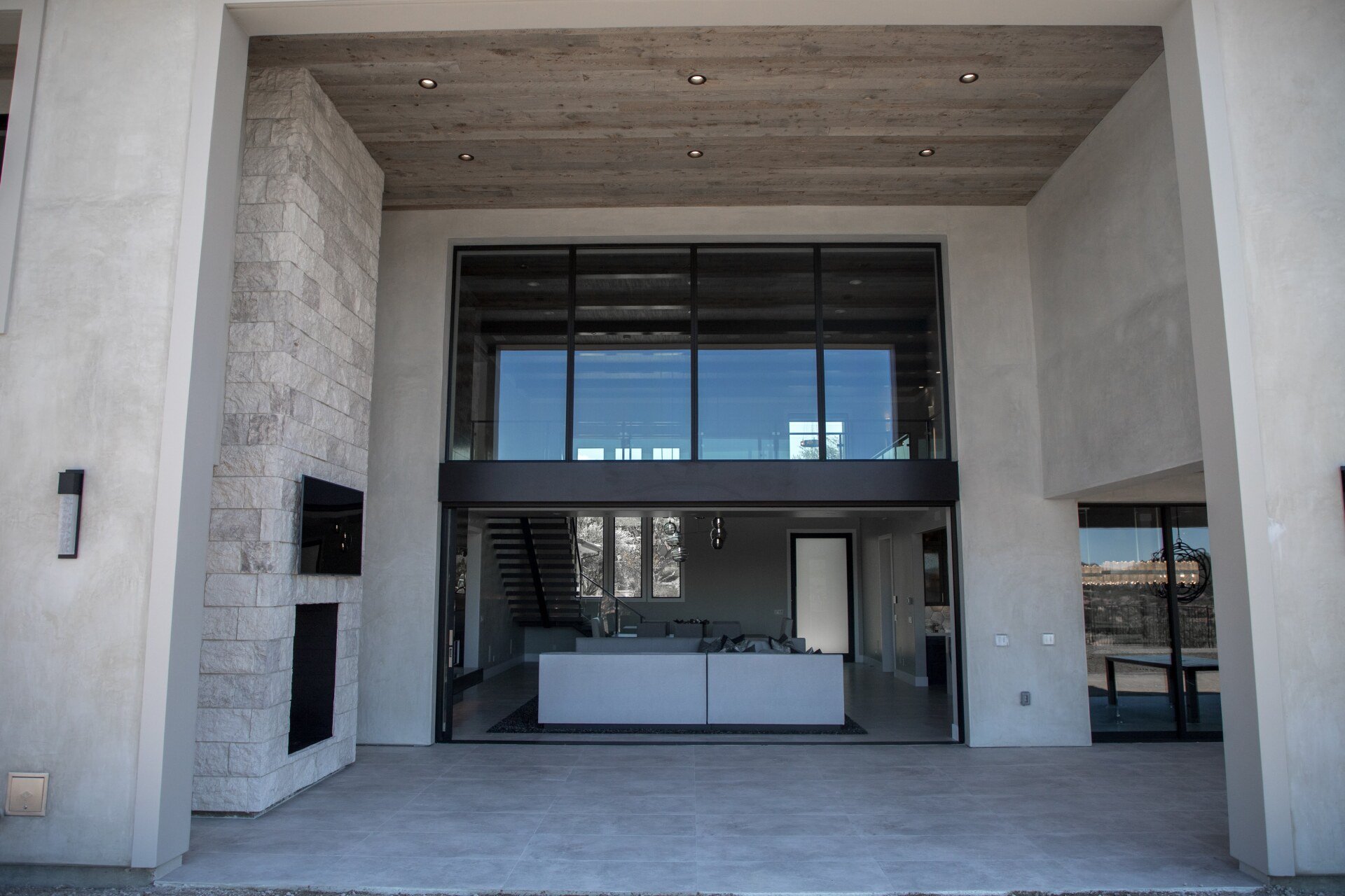 A large house with a lot of windows and a fireplace