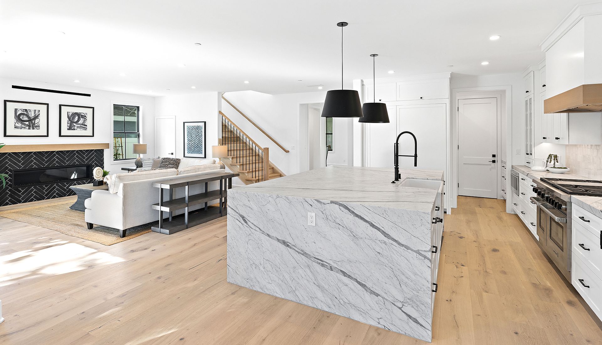 A kitchen with a large island in the middle of the room.