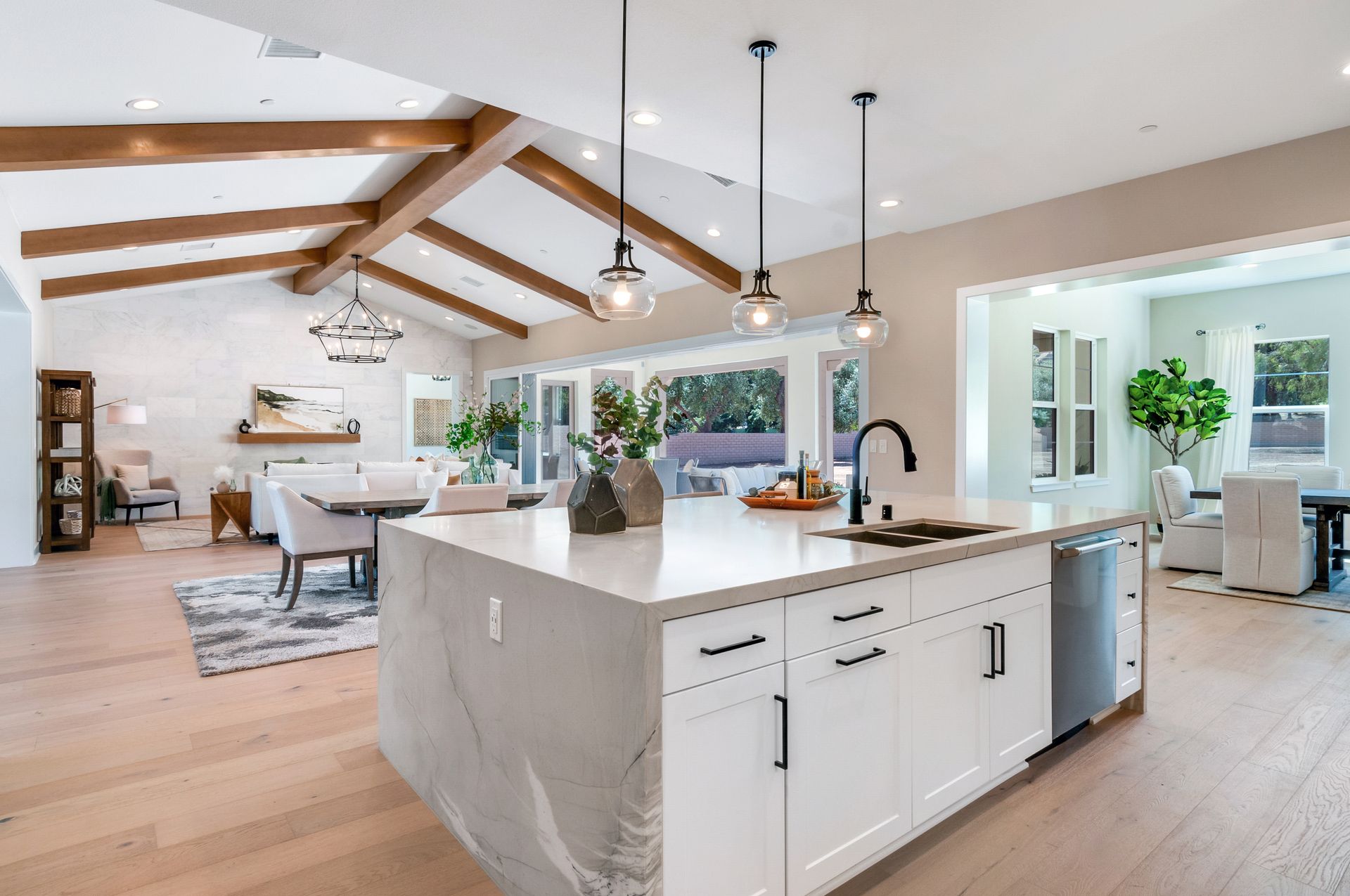 A kitchen with a large island in the middle of the room.