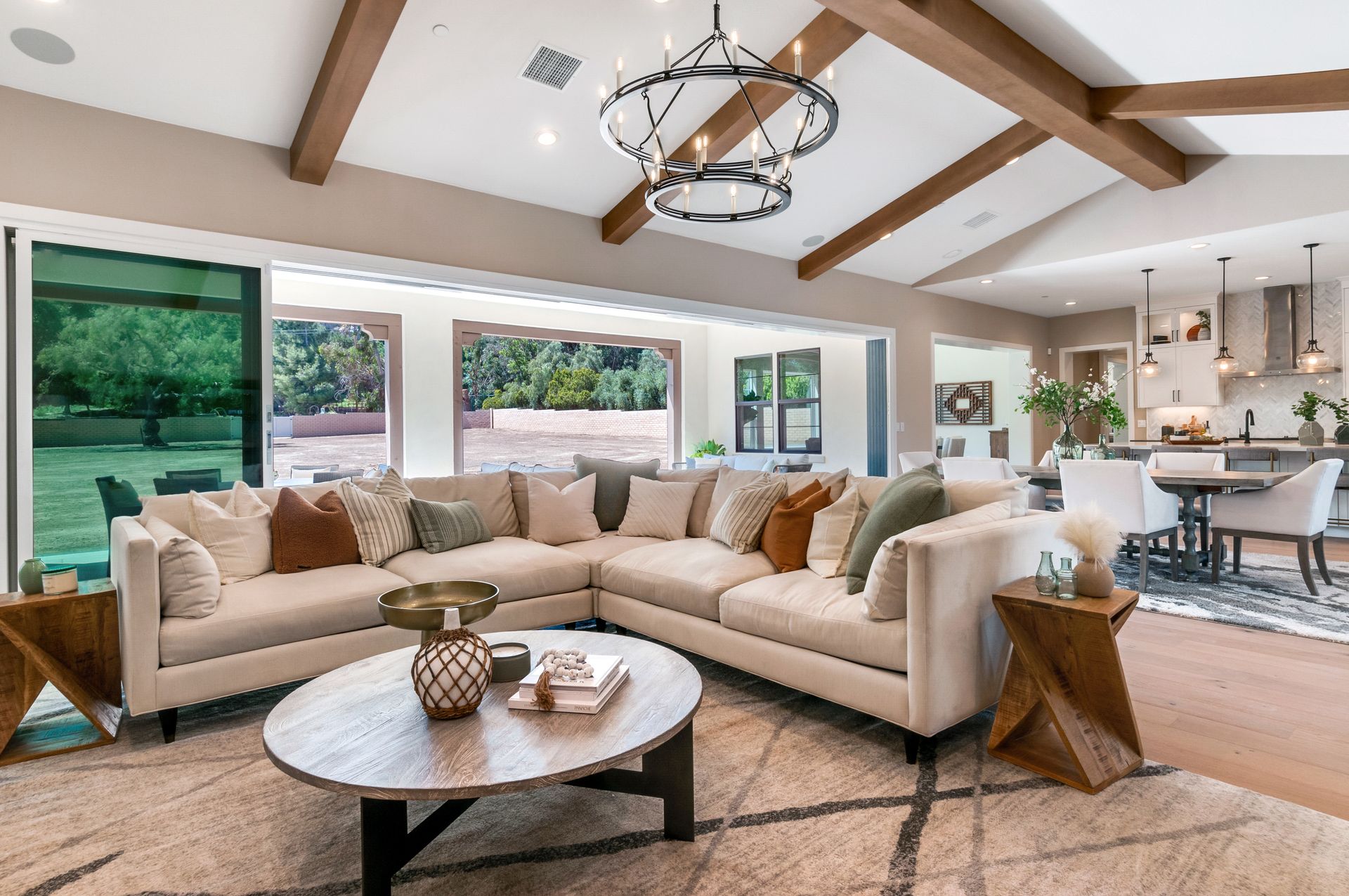 A living room with a large sectional couch and a coffee table