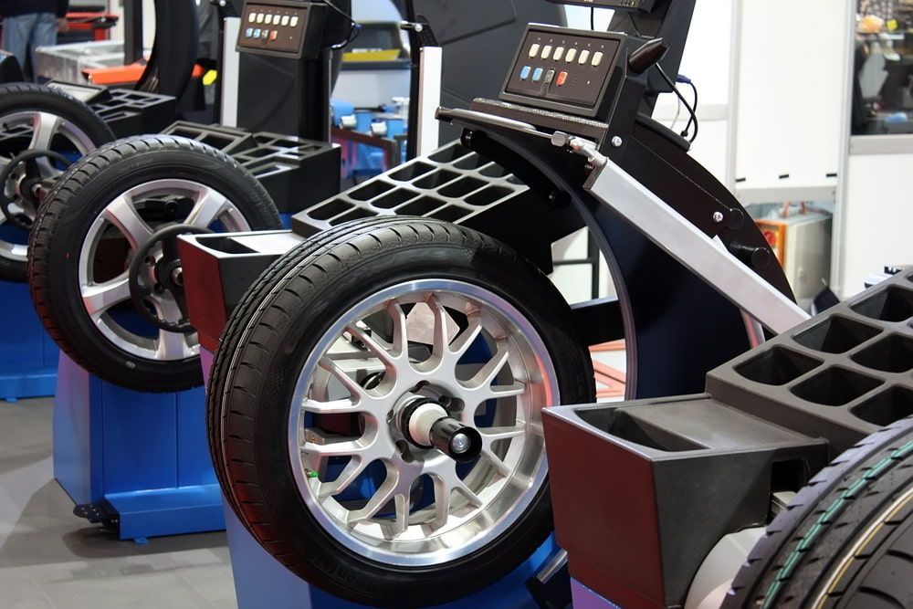 Wheels on a Wheel Balancer, in a Tire Shop, Ready for Balancing — Autopro Taree in Taree, NSW