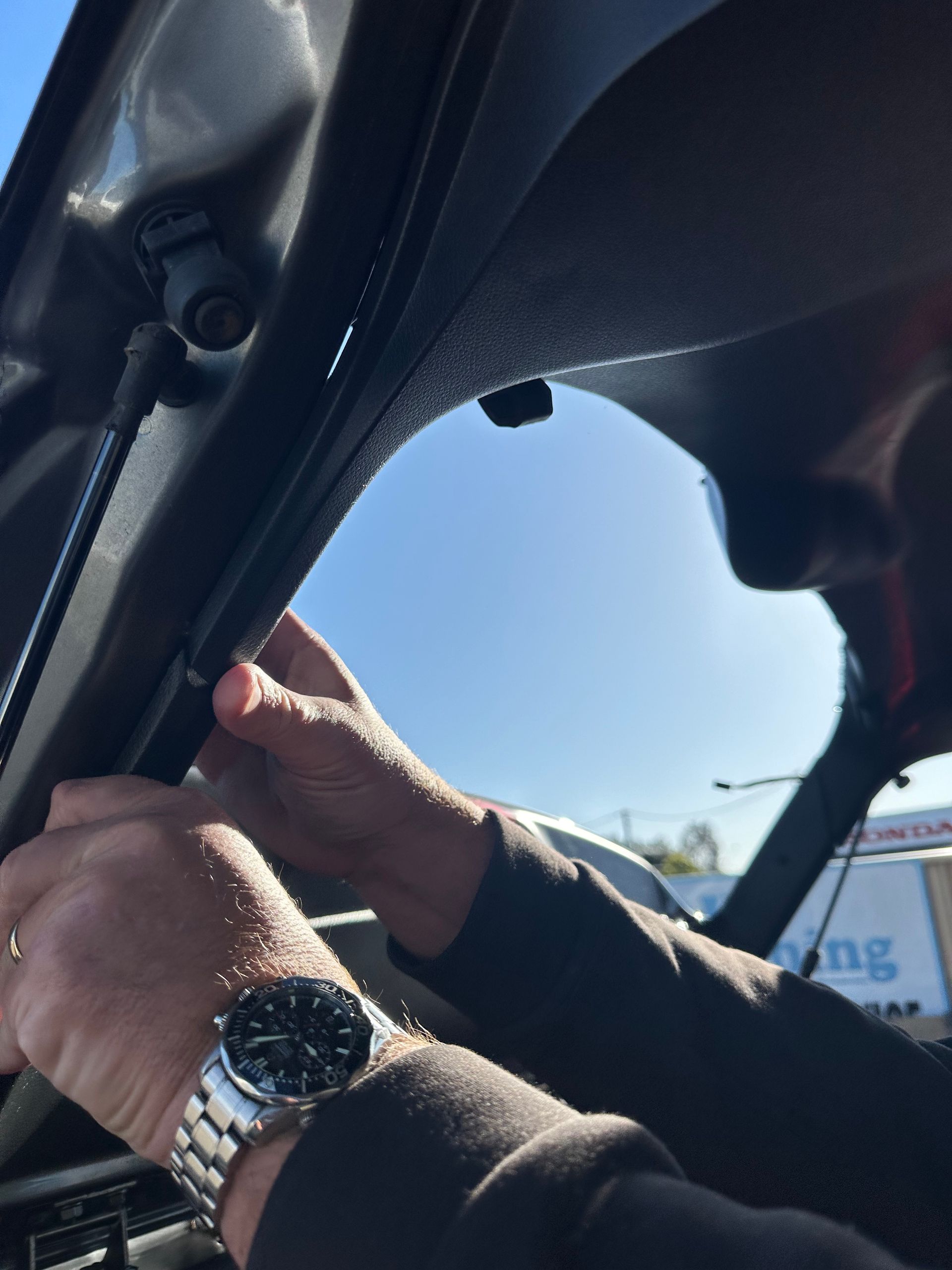 Hands Gripping a Car Windshield — Autopro Taree in Taree, NSW