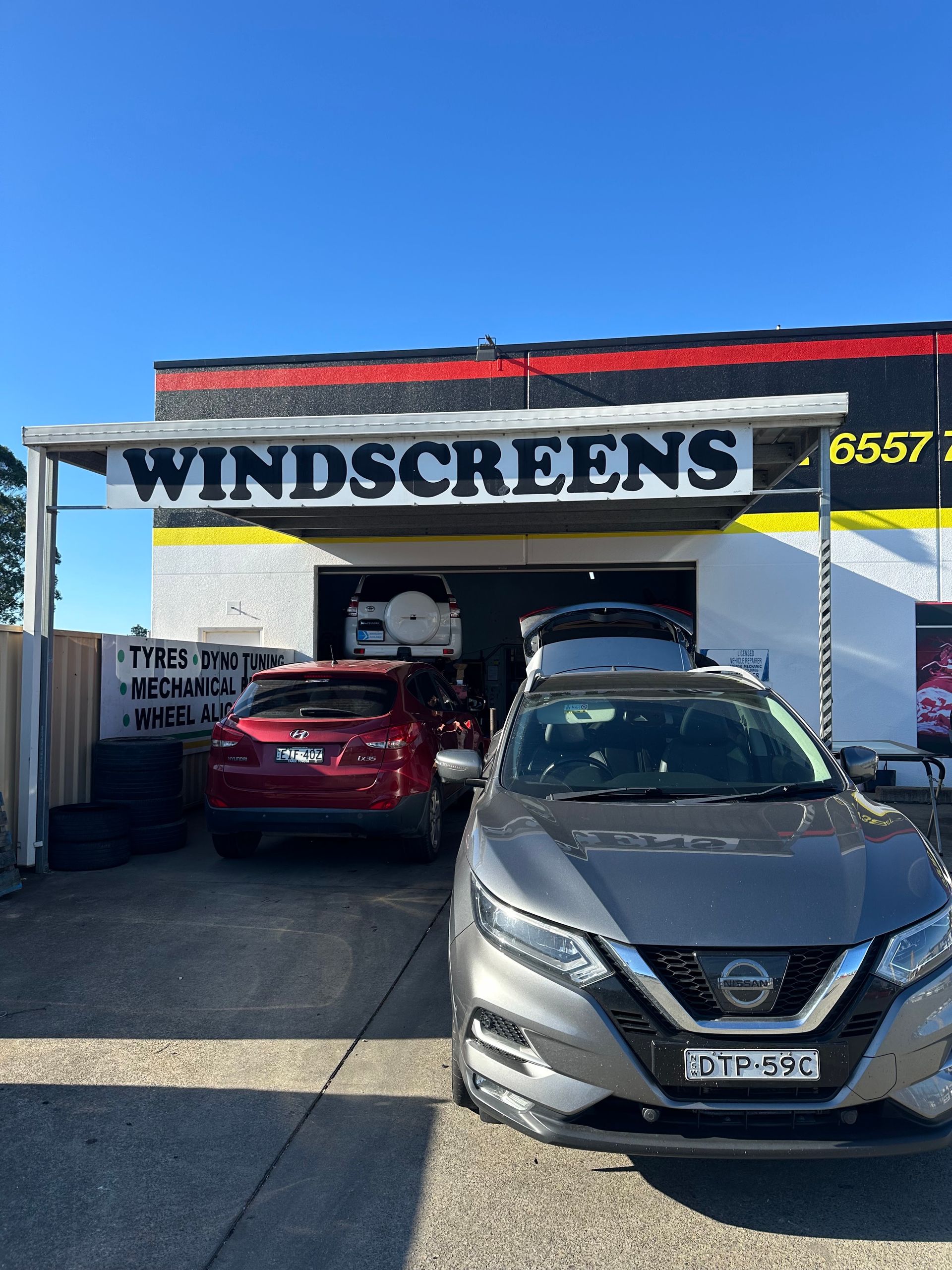 Cars Parked Outside a Windscreen Repair Shop — Autopro Taree in Taree, NSW
