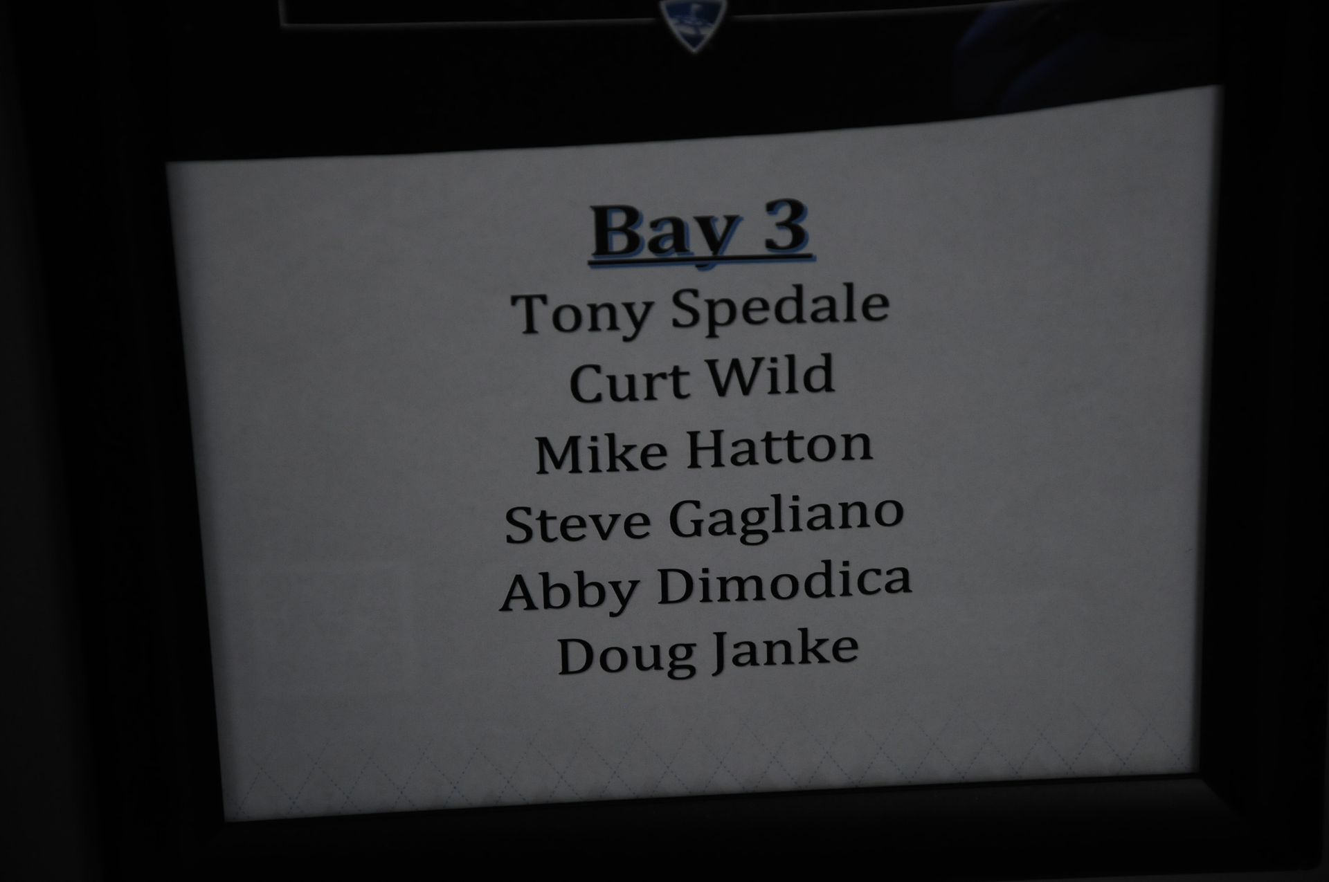 A sign that says bay 3 tony spedale curt wild mike hatton steve gagliano abby dimodica doug janke