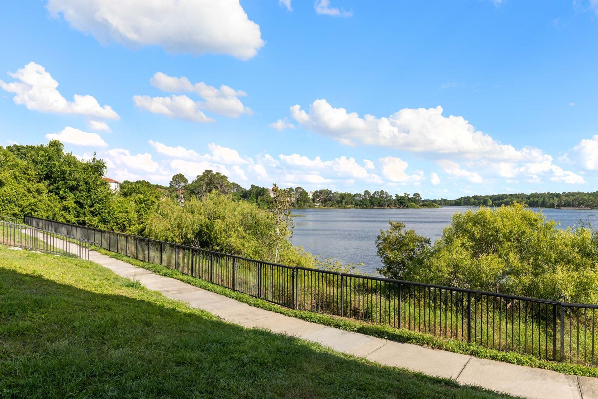 Lake with trail at The Debra in Orlando, FL.