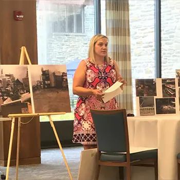 Annie speaking at an event