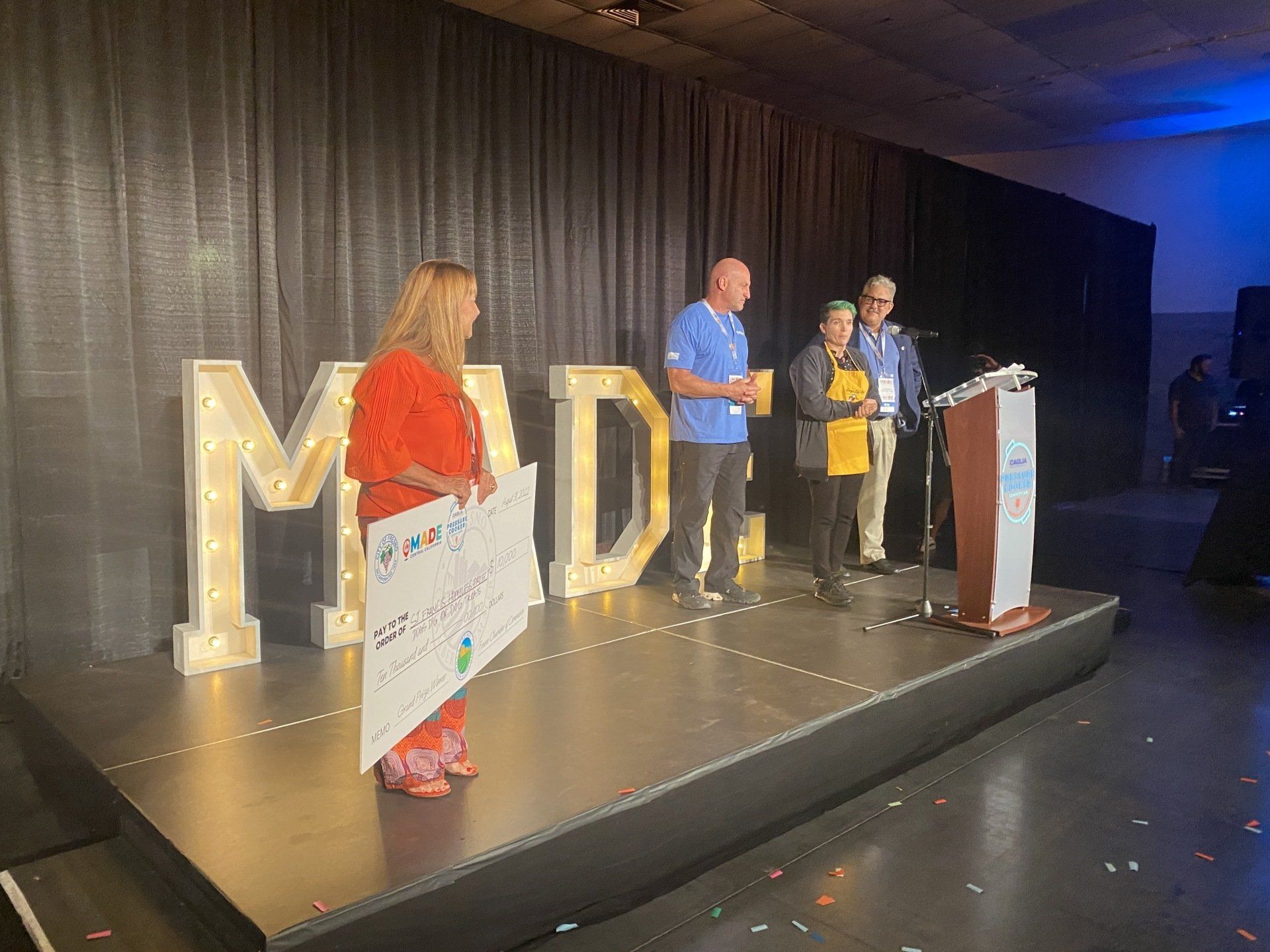 Grand prize winner accepts check for $10,000