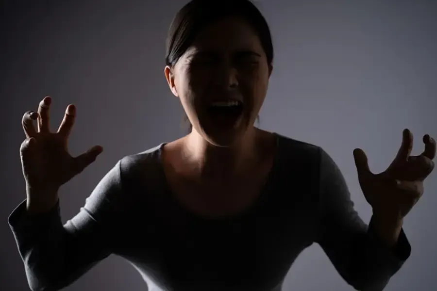 Woman yelling out in anger
