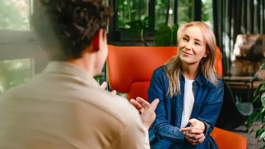 A smiling woman having a counseling session