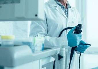 Medical Worker Holding Endoscope — Bakersfield, CA — American Digestive Liver & Nutritional Disease Center
