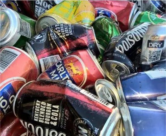 A Pile of Crushed Cans Including Kentucky Blended Bourbon Cola — Hastings Scrap Metal Recyclers in Rollands Plains, NSW