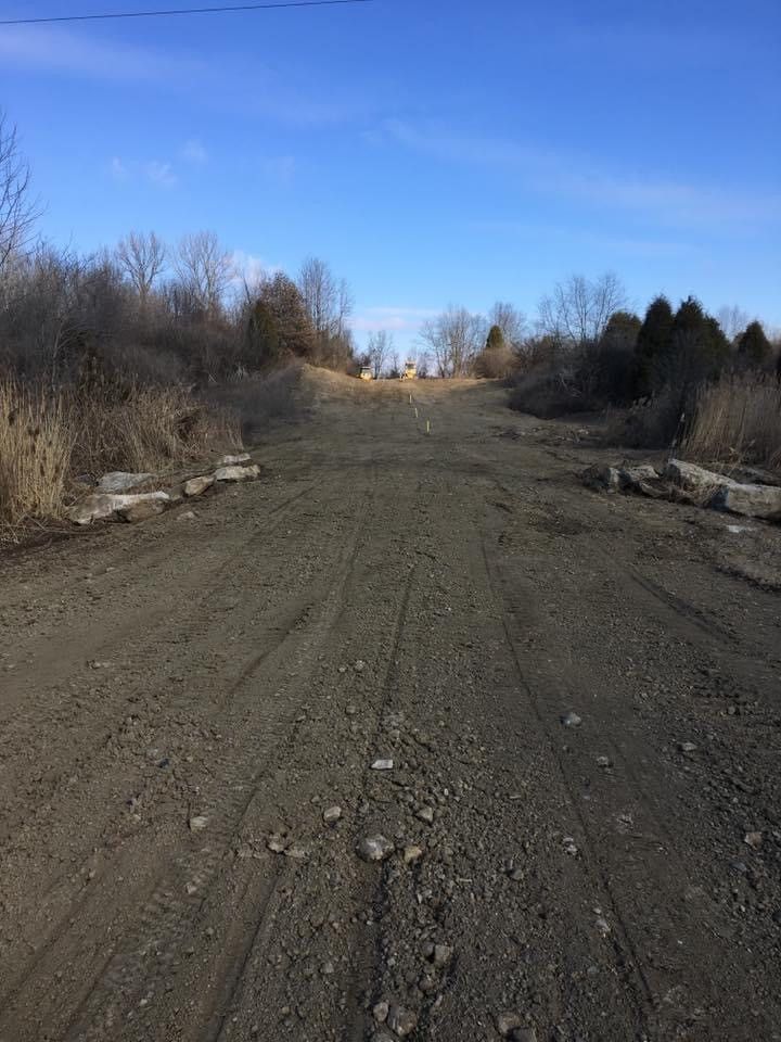 Gravel Road Ascending A Hill