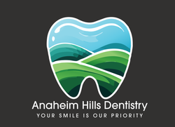 A logo for anaheim hills dentistry shows a tooth with mountains in the background
