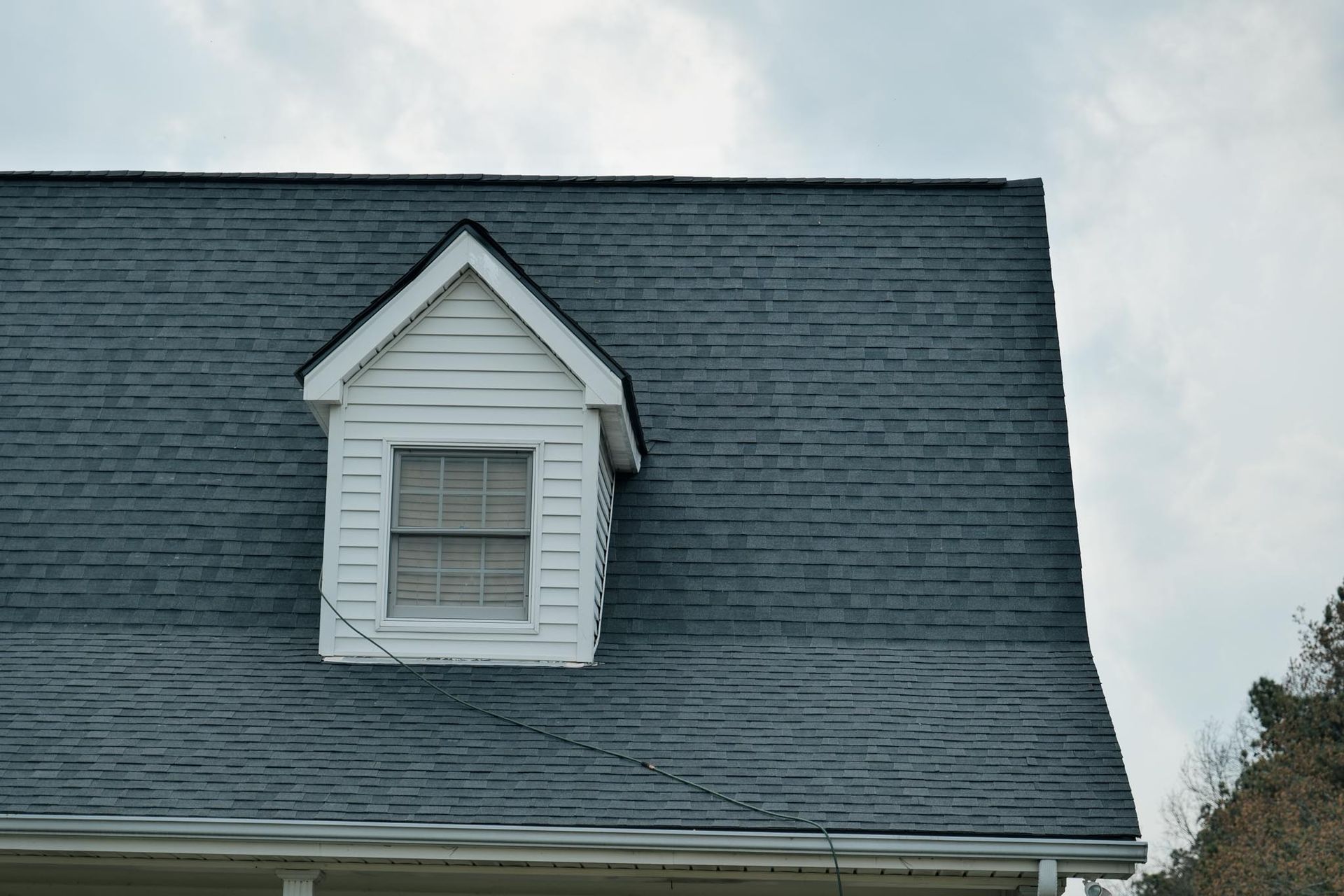 A house with a small window on the roof.