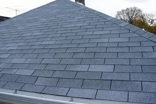 A close up of a roof with shingles on it.