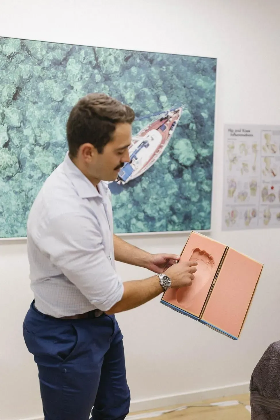 Man Holding a Food Mold for Custom Orthotics — Lord Street Podiatry in Port Macquarie, NSW