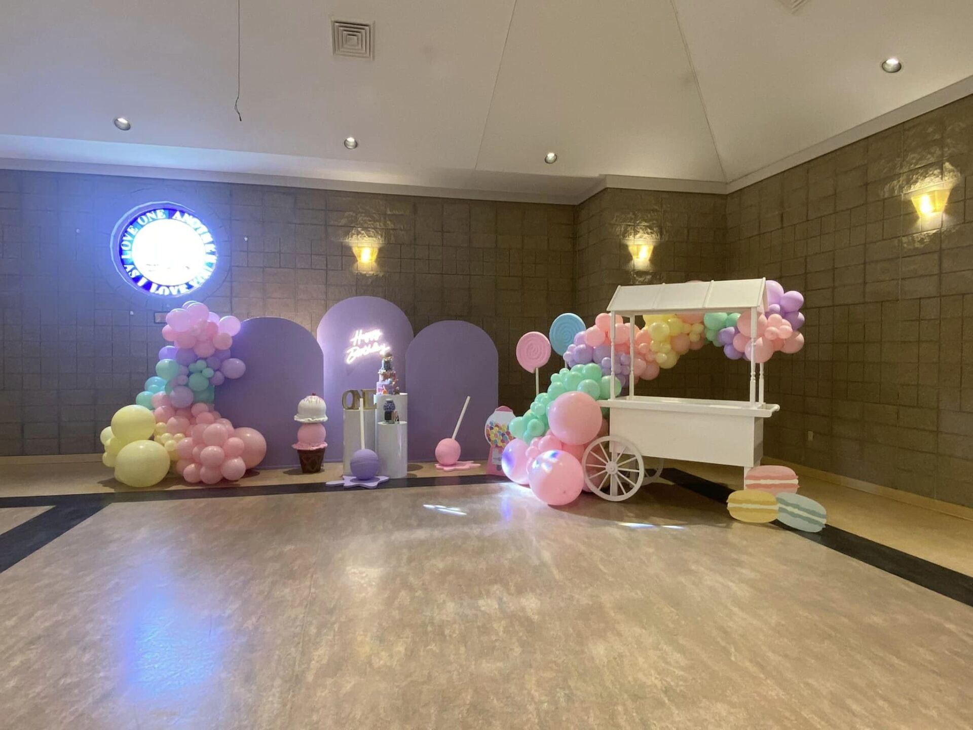 Candy land candy shop party with backdrop arch walls balloon garland and candy cart  props and green lattice also available for rent