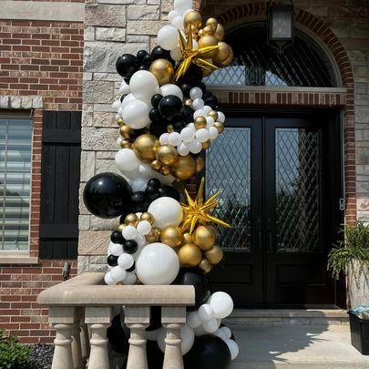 black, white, and gold outdoor deluxe balloon garland