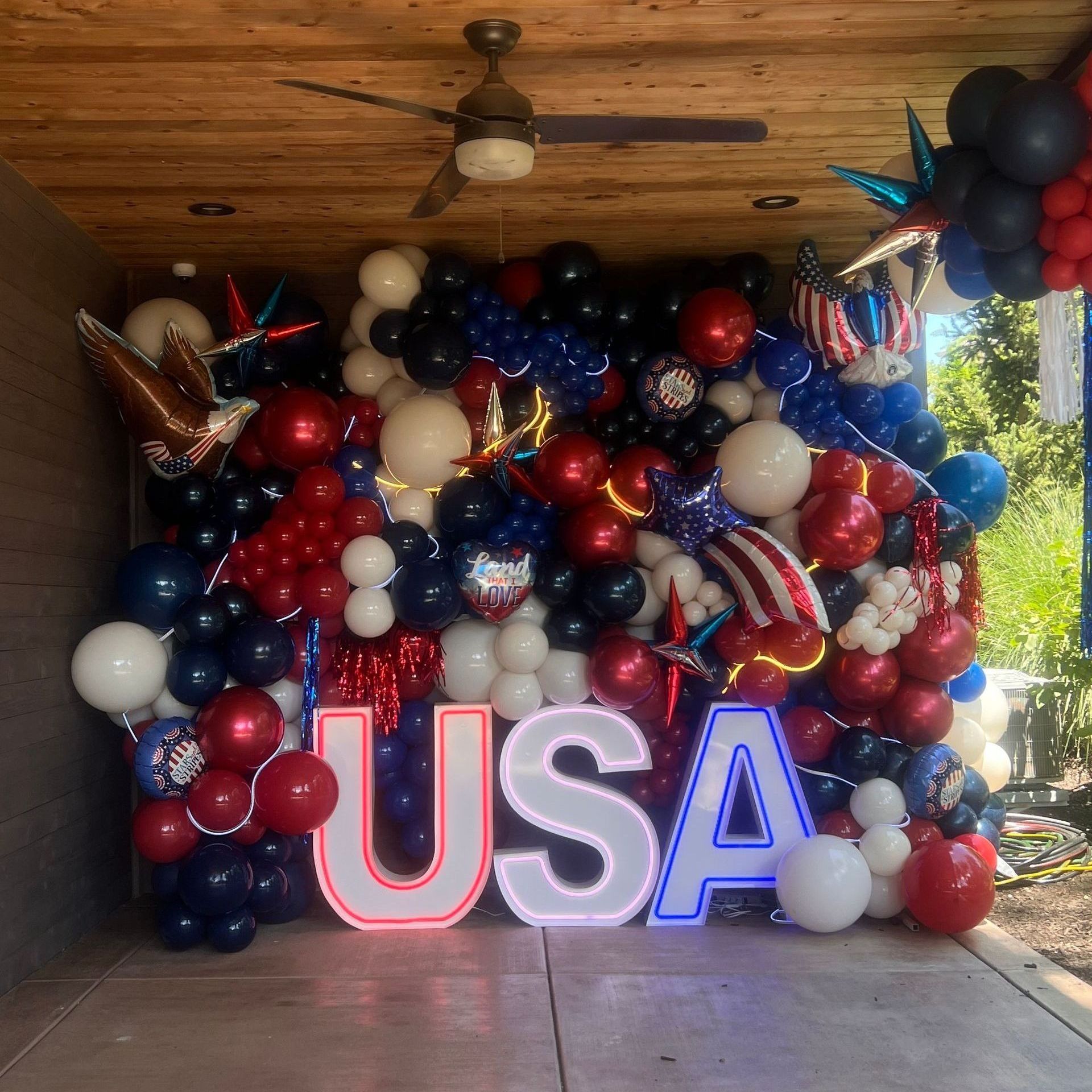 DELUXE USA balloon wall with foils and LED marquee letters for a July 4th event 