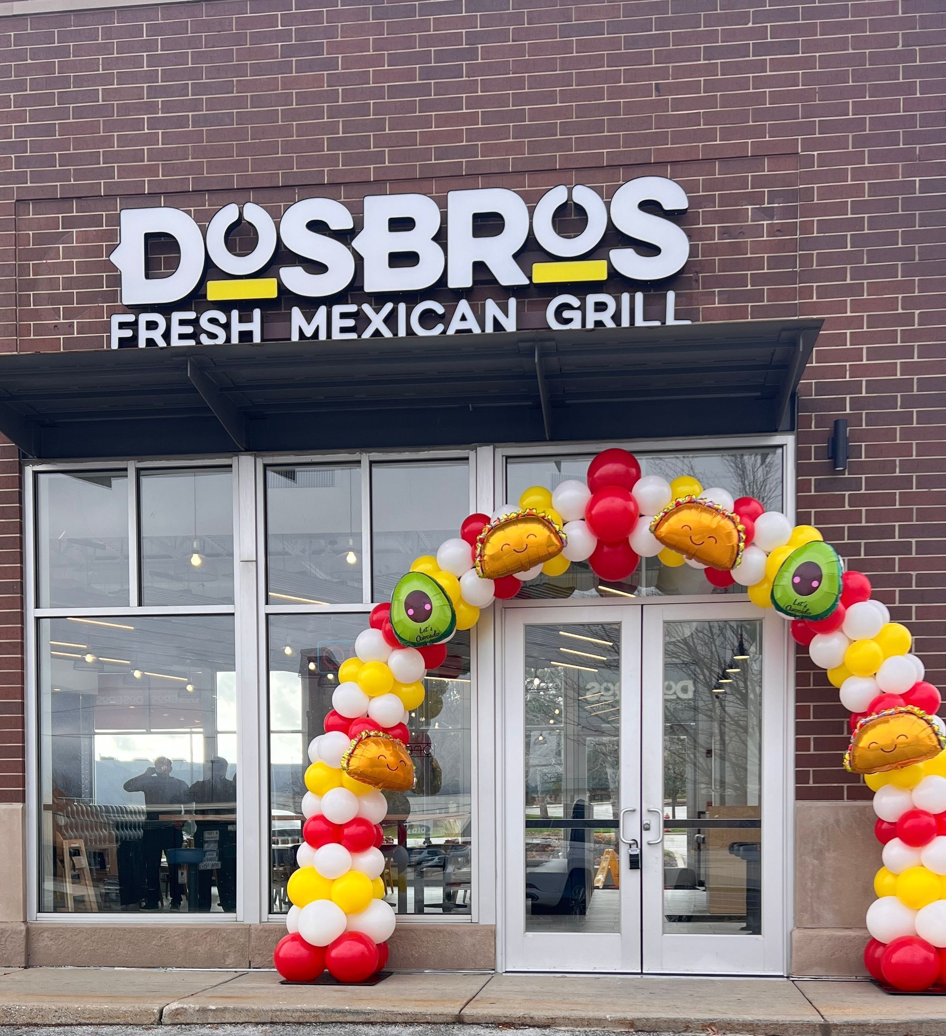 Dos Bros Grand Opening arch with custom colors and foils matching the brand 