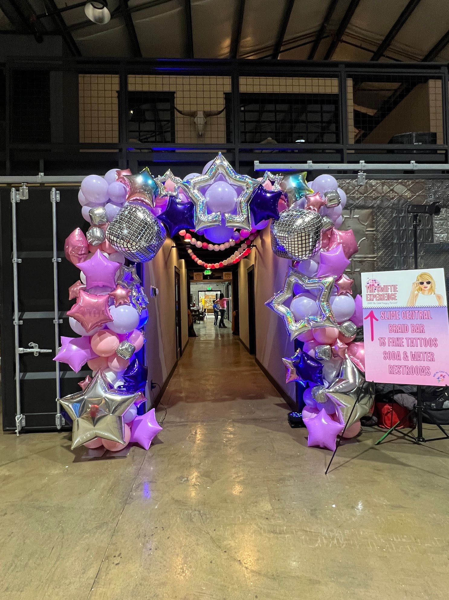 Swifties Unite under this Organic Deluxe Arch at an Immersive Experience benefiting a non-profit, NWI No Child Hungry 