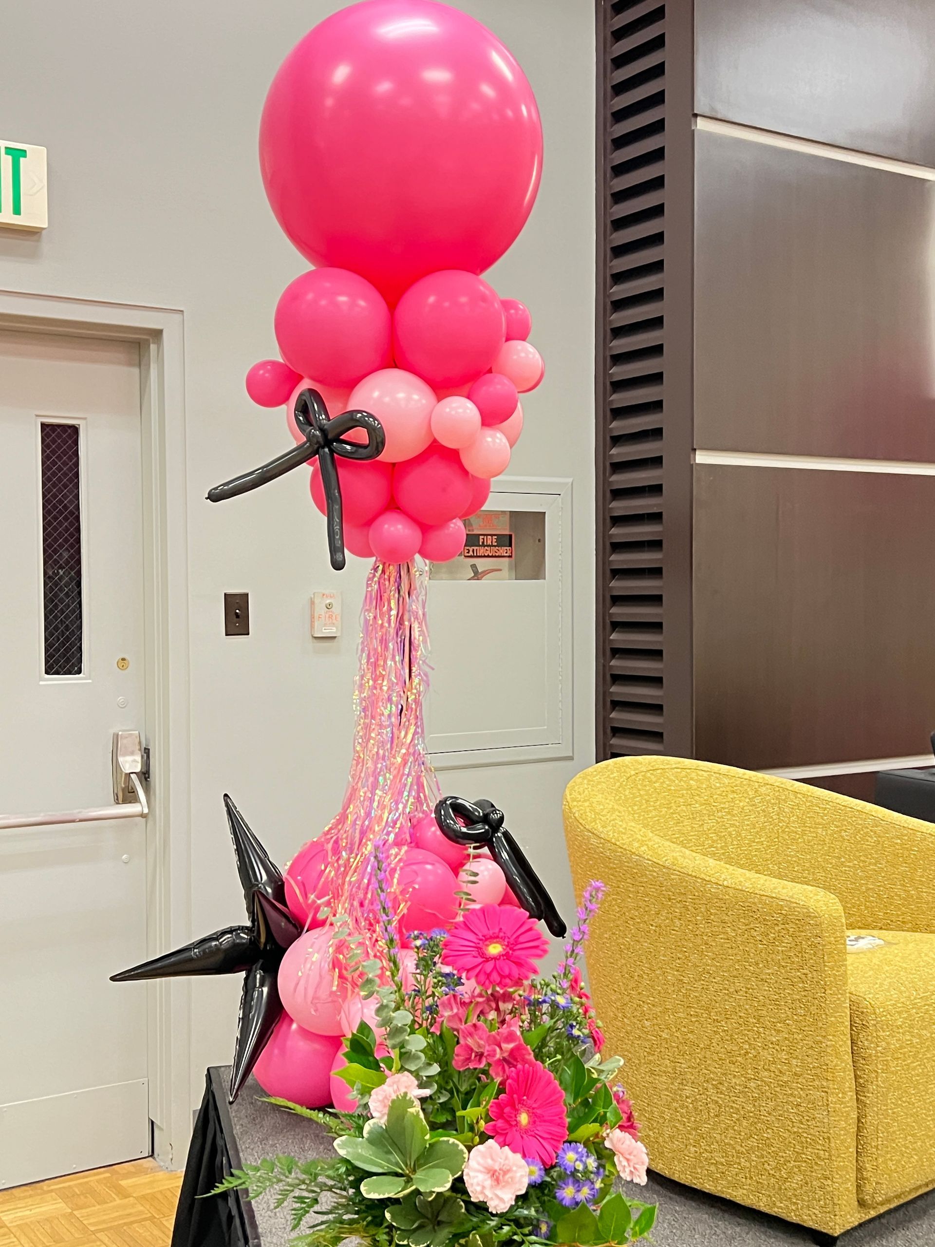 Shades of pink and black party column at Aberdeen Country Club, accented with black tappers and bow ties. A playful and stylish decor piece to set the perfect party mood.